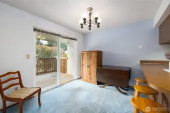 Open dining area with slider to private deck