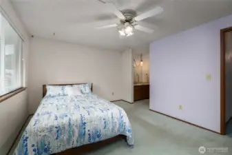 Primary bedroom with walk in closet and full bath