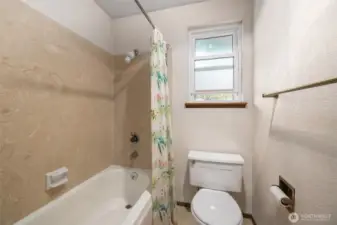 Upper level full bath opens to extra storage room (see floorplan)