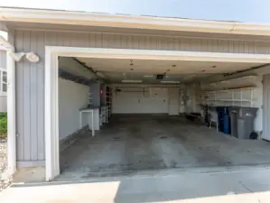 Attached Two Car Garage with Pull Down Stairs Above for Extra Storage.
