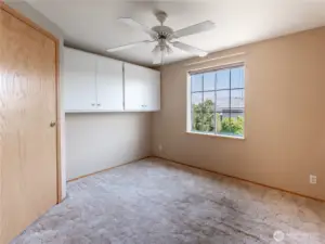 Second Bedroom with Built-In Cabinets and Walk-In Closet.
