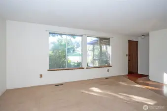 Step into this home and enjoy the large picture windows overlooking the fully fenced yard.