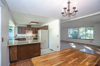 Dining area seamlessly open to both the living room and kitchen.