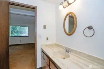 Another angle of the primary suite bathroom showcasing the generous counter space.