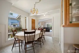 The dining room looks out through the large picture window, to the landscaped yard that feels like a courtyard.