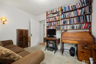 Another view of the TV room with all the built-in book shelves.