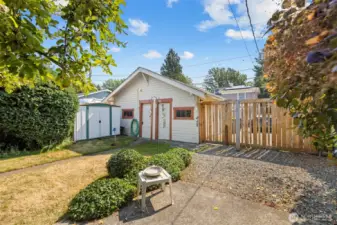 There is a storage building adjacent to the 2 vehicle garage off the alley in the fully fenced rear yard.