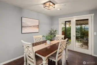 Dining space with French doors to the covered patio out back