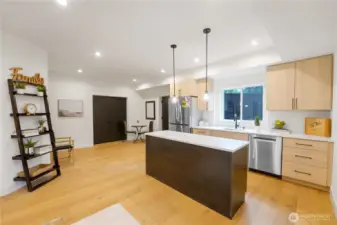 Self-contained apartment unit with French door refrigerator, induction burner and counter convection oven