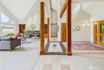 The view from the living/dining room areas down the hall to the main floor bedrooms and den/office.