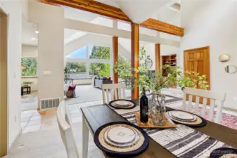 The dining room adjacent to both the kitchen and living room shares the exceptional daylight and views.
