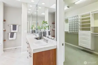 The large walk-in closet adjacent to the primary bath.