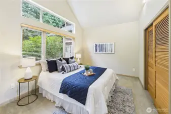 Also on the main floor is a second bedroom suite with vaulted ceilings and tons of daylight.