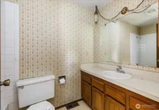 With a tub shower combo and large vanity, this bathroom provides great space and the ability to improve upon it.