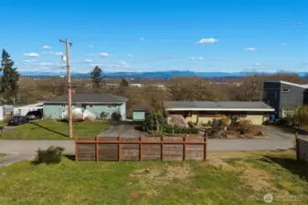 Street-level view of vacant land for sale in Seattle with residential surroundings