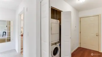 Entry offers 2 closets, one contains stackable washer & dryer that stay.