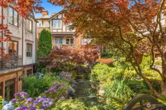 Lush landscaping with specimen trees and flowers