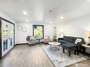 French doors fill the space with natural light and easy indoor-outdoor flow.