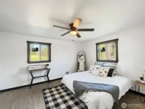 Spacious primary suite with room for a king bed, seating area, and more.