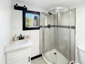 Smartly laid out 3/4 bath with walk-in shower and modern finishes.