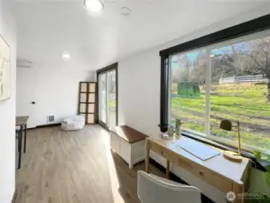 Bonus room offers peaceful views of the front yard and nearby horse corral.