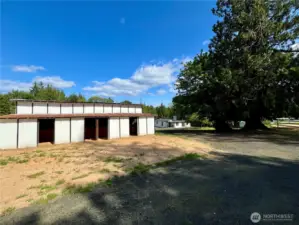 Side view of the barn featuring open stalls—ready for horses, livestock, or storage.