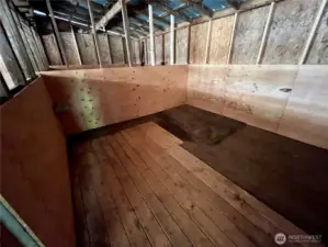 Small animal stall with recent repairs—rotted boards replaced for a safe, ready-to-use space.