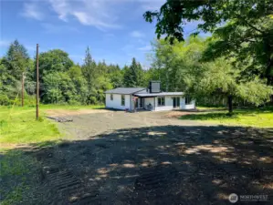 Long private driveway leads to your peaceful country escape.