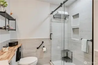 Primary bathroom with step-in shower.