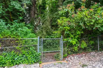 Gate to greenbelt trail to park.