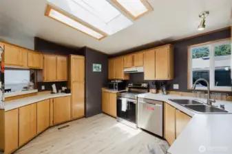 Skylight brings in so much light! Pass-through to the living area so you can be engaged while cooking your specialty!