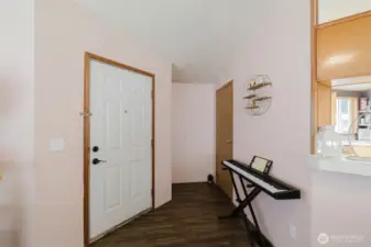 Front door and coat closet to the right