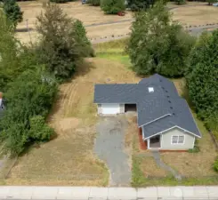 Home on a nearly half acre lot in the heart of Morton, with Mountain Views and a park behind.