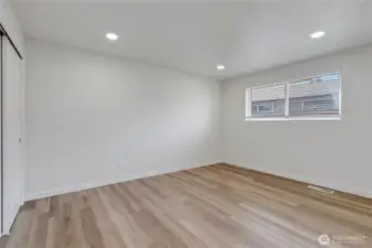 Bed next to guest bath