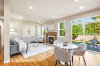 Sliders off the casual dining area lead to the paved patio for seamless indoor-outdoor living.