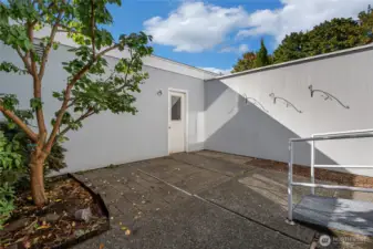 Large patio leads to the 2 car garage