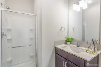 Main floor guest bathroom with shower.
