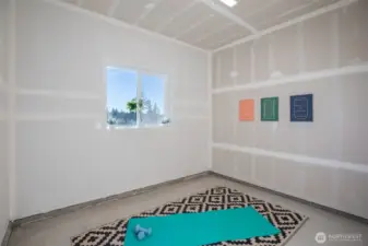 Large flex room for a workshop, a gym or additional storage room.