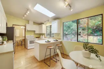 Roomy kitchen has eating area plus a bar.