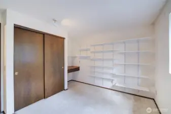Second bedroom with built-in desk.