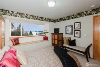 Primary with window seat to take in the sparkling water view