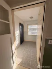 Let's check out the inside.  Coming in from side door, there is a large entry way- perfect for taking off your muck boots or galoshes or just having a great entry way.