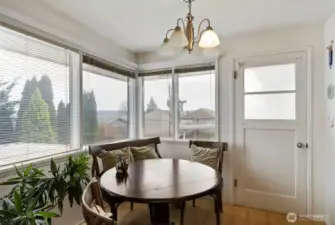 Dining area off kitchen and view of Mt. Rainier and peekaboo view of water.