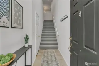 Through front door, lower-level entry off the garage with a convenient coat area, perfect for everyday drop zone before heading upstairs.