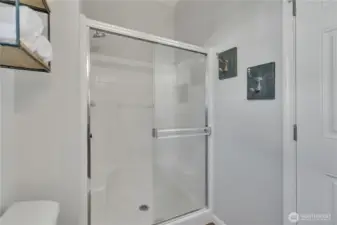 Primary bathroom features a convenient standalone shower.