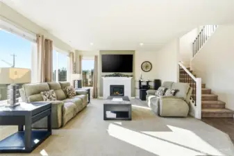 The home is set up with technology that allows seamless connectivity and entertainment throughout.