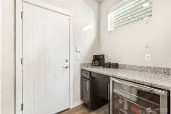 Don't miss the custom coffee bar and doggie door just below the counter!