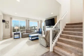 The wide stairway easily allows furniture to move up and down in the home.