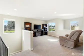 Upstairs, the landing area can serve as an additional living space or entertainment area.
