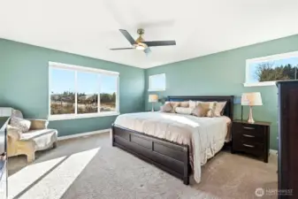 The large, primary bedroom invites relaxation and solitude.